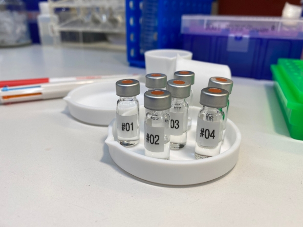 "NYU Study Finds Gel Treats Gum Disease by Fighting Inflammation; photo of vials in a medical lab"