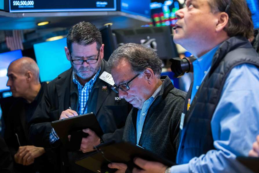 Not so fast, robots: Humans are still the best stock traders; Traders on the floor of the New York Stock Exchange. Photo courtesy of NYSE Group.