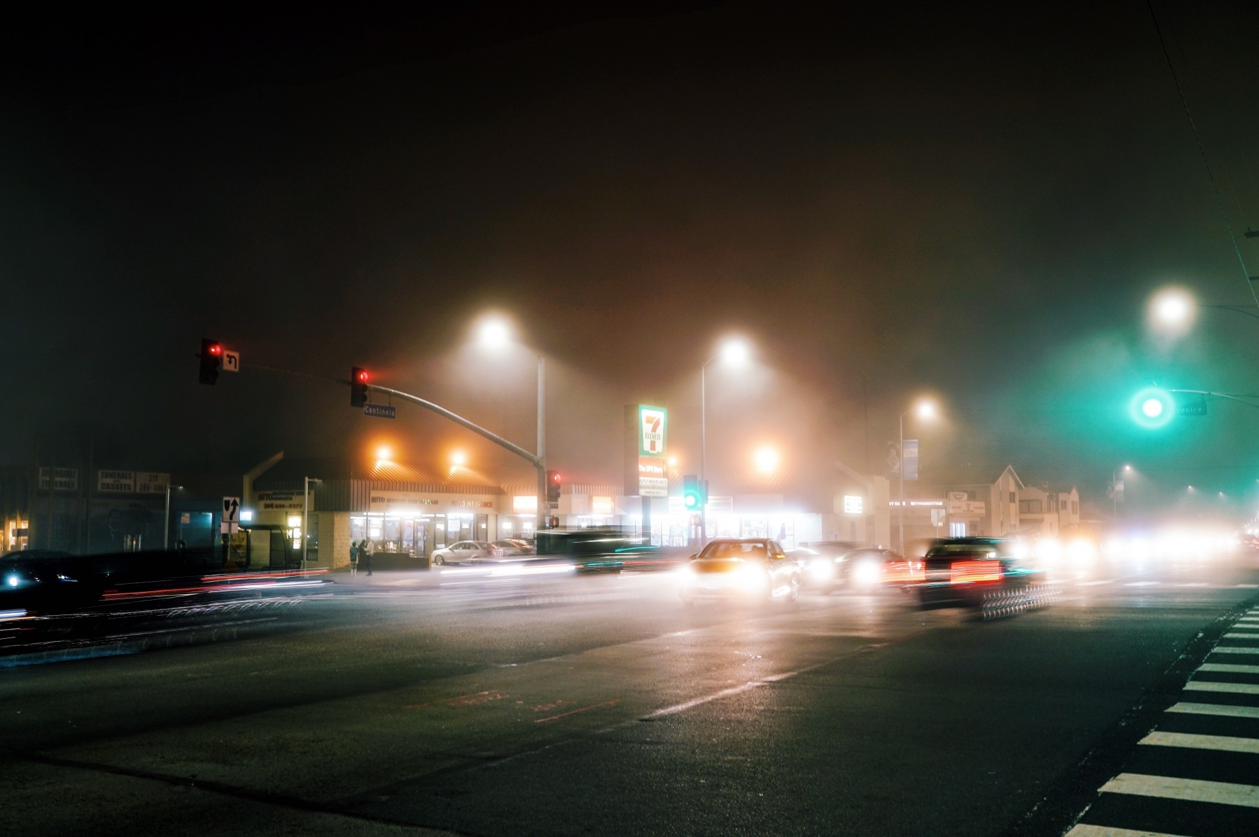 Light Pollution May Extend Mosquitoes’ Biting Season; Photo of a busy & rainy intersection