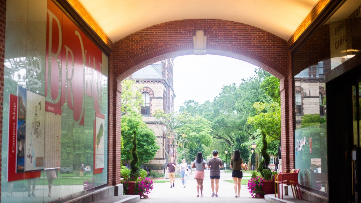 Brown University initiative to replace loans becomes permanent after fundraising goal achieved; Photo: Students at Brown walking by entrance of a building