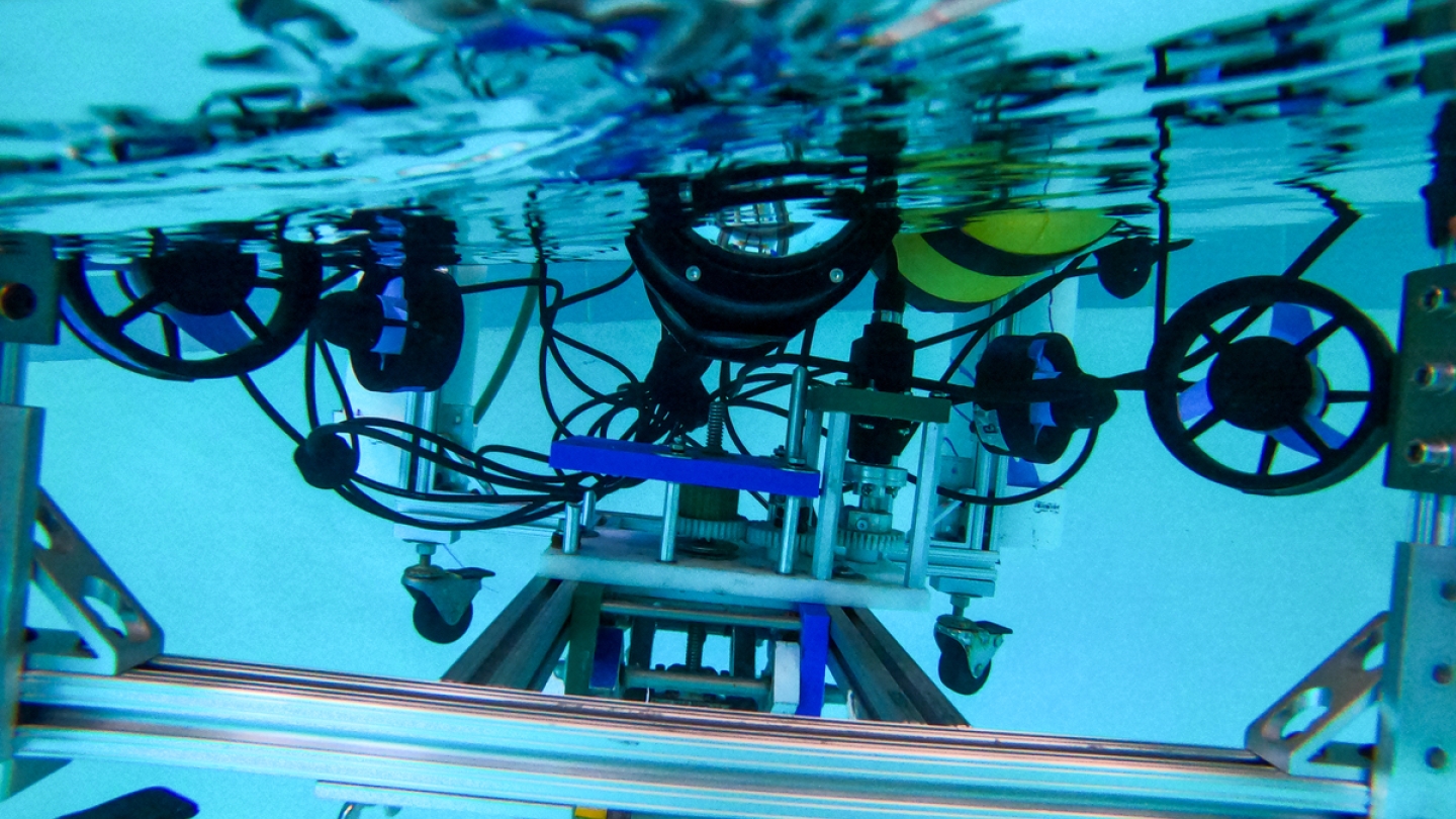 Custom-made Robots Could Build Concrete Structures Underwater; Guarini PhD student Samuel Lensgraf is working with the Dartmouth Reality and Robotics Lab on a mobile robot that can move heavy blocks for construction projects on the ocean floor. (Photo by Katie Lenhart)