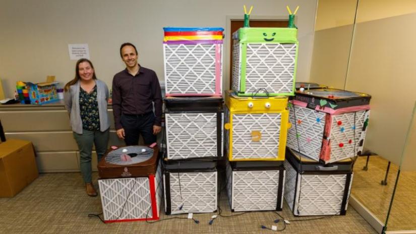 Study authors Robin Dodson, a research scientist at Silent Spring Institute, and Joseph Braun, a Brown associate professor of epidemiology, helped assemble Corsi-Rosenthal boxes.
