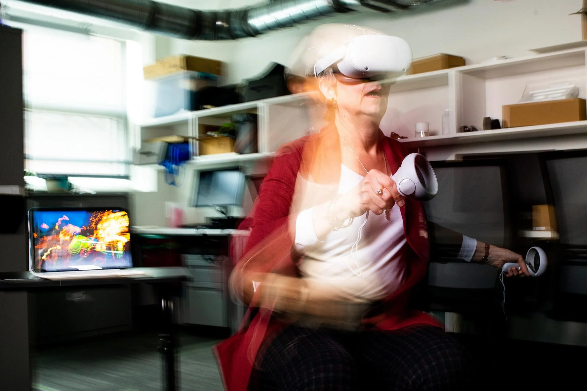 How Virtual Reality Can Help Relieve Chronic Pain; “VR has this real potential to encourage movement in people with chronic pain where they might be otherwise afraid to move,” says Nancy Baker, here demonstrating a VR headset, while what she sees plays on the nearby iPad. Photo: Alonso Nichols