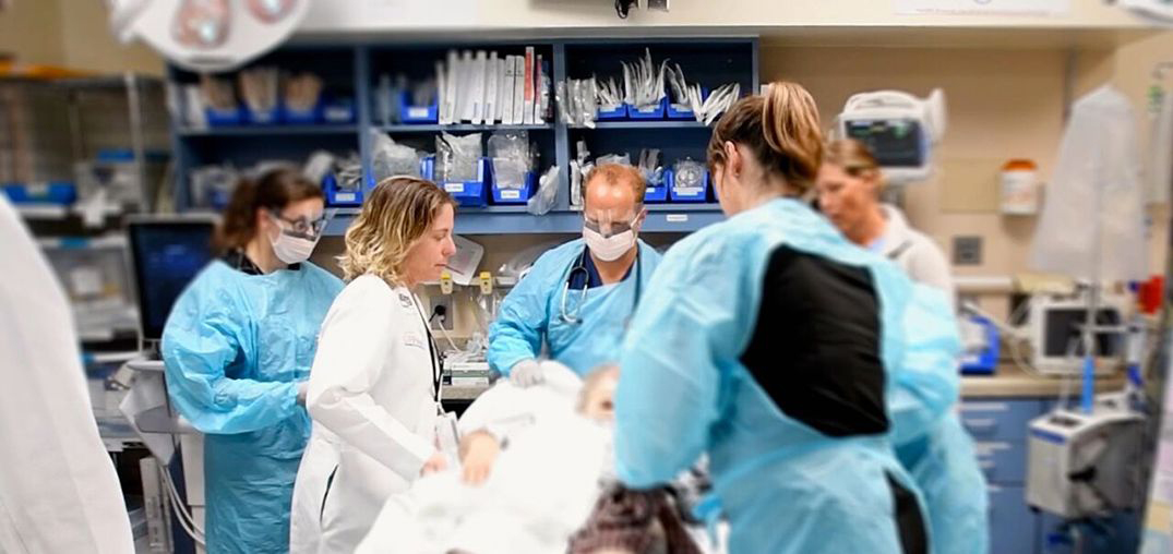 Marie Crandall cares for a patient at University of Florida Health, Jacksonville.