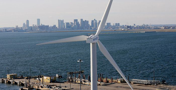 Image: Wind turbine overlooks harbor.