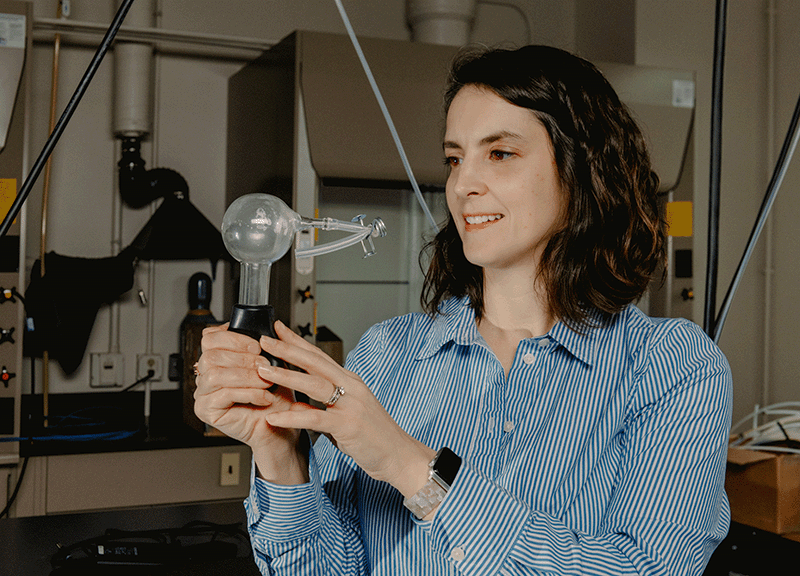 "woman holding an instrument that measures clouds; Cloudy Science, Clear Insights: Atmospheric Scientist Studies Clouds’ Causes and Effects"