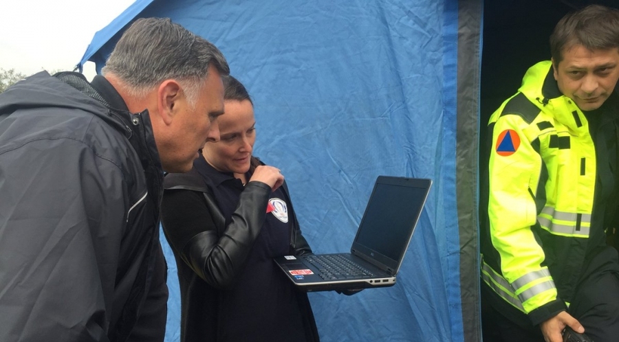 During a 2018 NATO consequence management field exercise, Stephanie Foster briefed then-Department of Homeland Security Science and Technology Directorate Under Secretary (Acting) William Bryan on NICS as he observes its use in water-rescue operations conducted by teams in the Western Balkans.