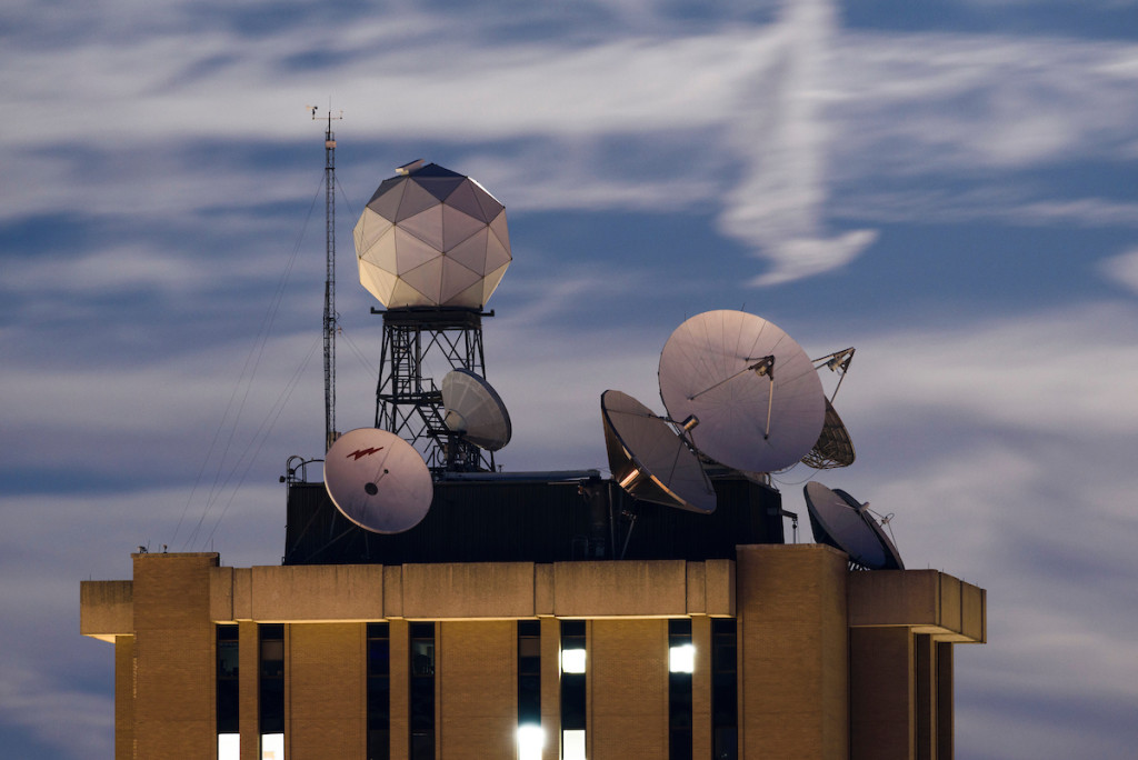 Satellite dishes and weather-related equipment mounted atop the Atmospheric, Oceanic and Space Sciences Building help UW researchers track the weather.