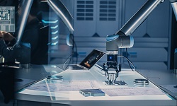 Robotic arm operates and moves a metal object