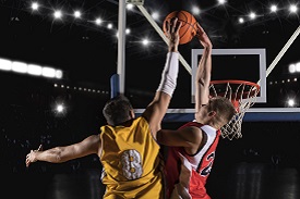 two people playing basketball