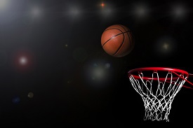 A basketball about to go into the net