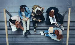College students sitting togehter on some steps