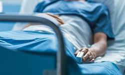Photo of a cancer patient lying in a hospital bed