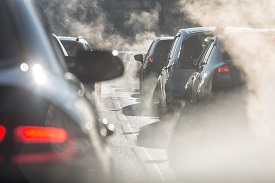 cars surrounded by exhaust fumes