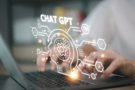 An individual uses chatgpt on a laptop