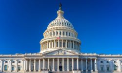 The Capitol Dome with blue sky.
