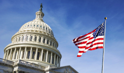 The American flag next to the Capitol Building