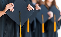 Students holding their graduation caps