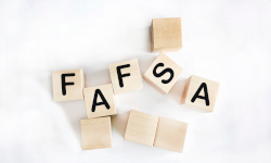 Lettered wooden cubes that spell FASFA