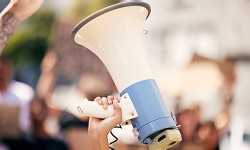 An air horn held up in the air during a protest