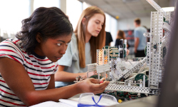 Image of young students working on a project