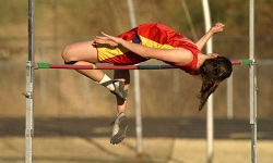 A woman high jumps