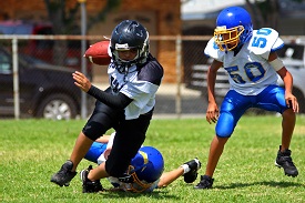 kids playing tackle football