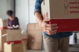 a man and a woman with moving boxes