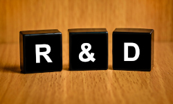 Photo of blocks that say R&D