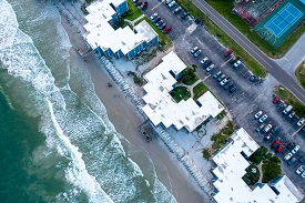 over head shot of apartment buildings along a beach