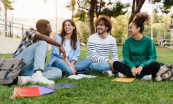 Students sitting together on grass