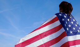 A woman holds an American flag