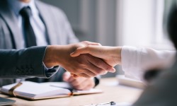 employer and employee shaking hands