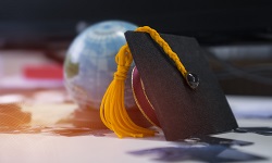 Globe with graduation hat