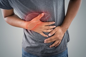 A person presses their side in discomfort; a red outline of a liver is superimposed on the person's body