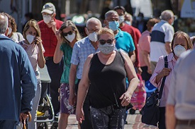 a crowd wearing masks
