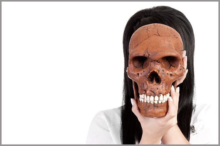 woman holding face mask
