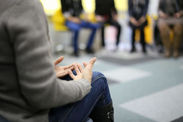 Image of people sitting in a circle