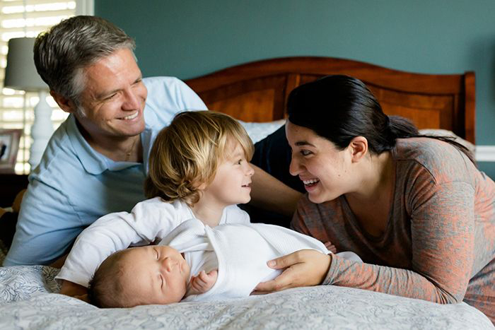 Image: parents playing with children