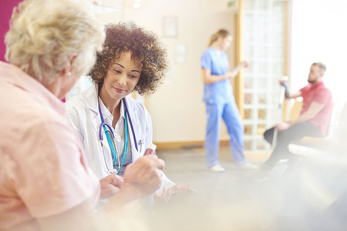 Image of doctor talking with patient.