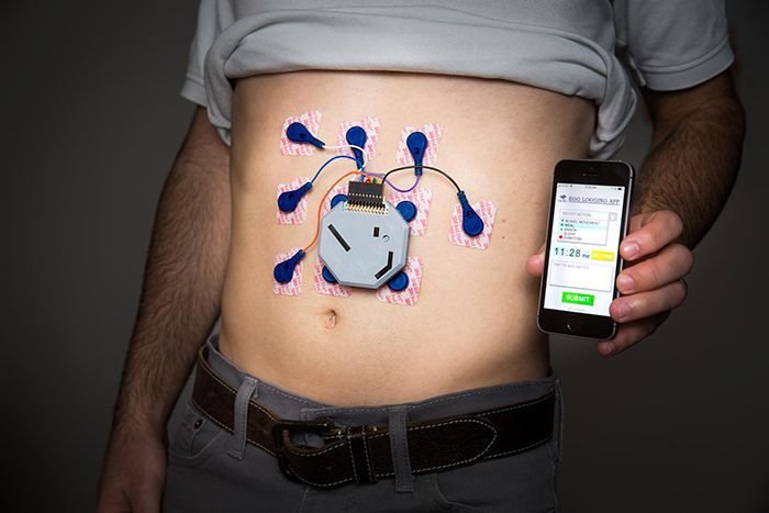 Man wearing stomach monitor