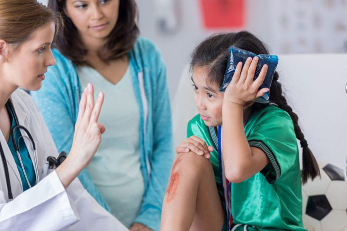 Young girl being treated for a concussion