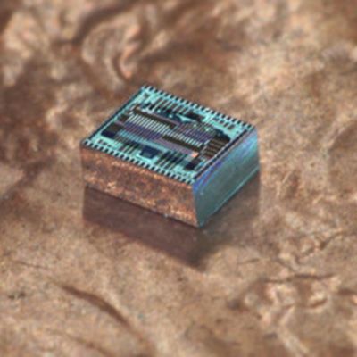 The OPA chip placed on a penny for scale. 