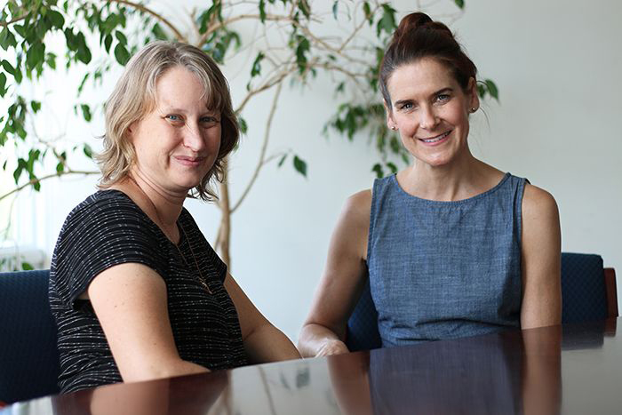 Psychology and neuroscience professors Andrea Hussong (left) and Deborah Jones