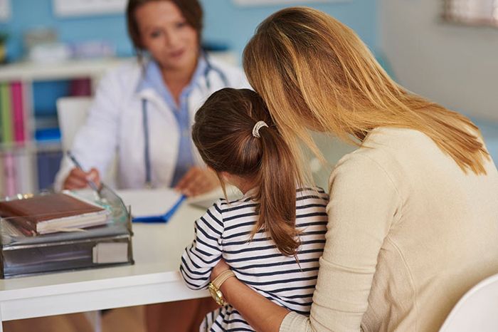 Child, mother and doctor