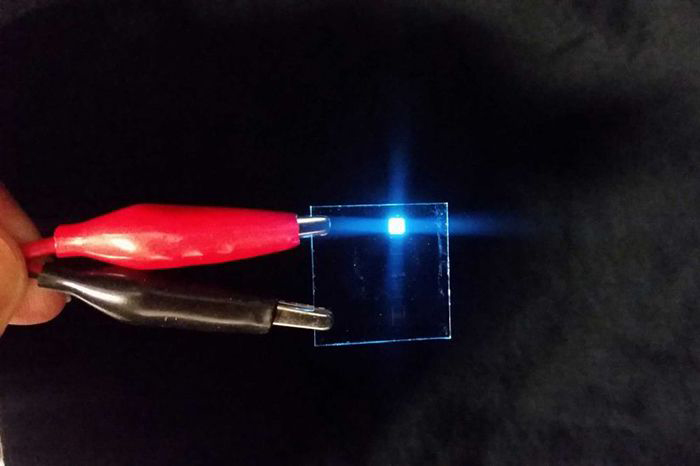 Chemist Mark E. Thompson holds new copper-based LEDs invented by him and a team of chemists.