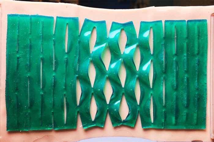 A kirigami-patterned adhesive