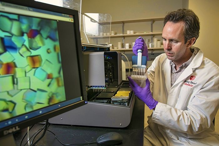 Mike Airola works with samples of a key enzyme, nSMase2