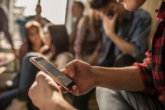 Image: Young man using cellphone