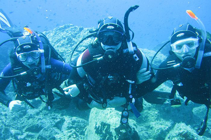 Virginie Papadopoulou dives with her father and brother in Lesbos, Greece in 2010.